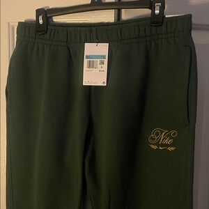 Nike standard fit medium taper leg Joggers with Gold Embroidery